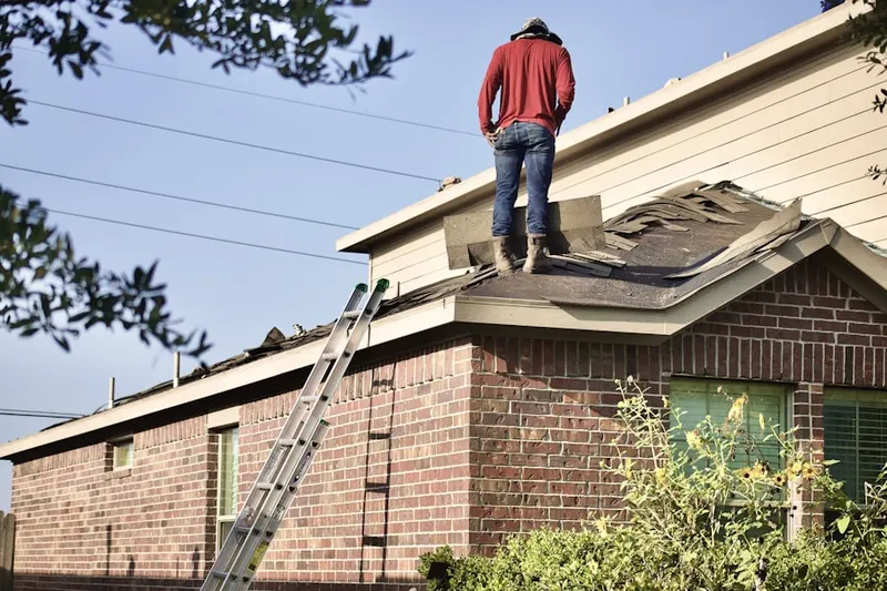 Professional roofer working on a residential roof in Greece